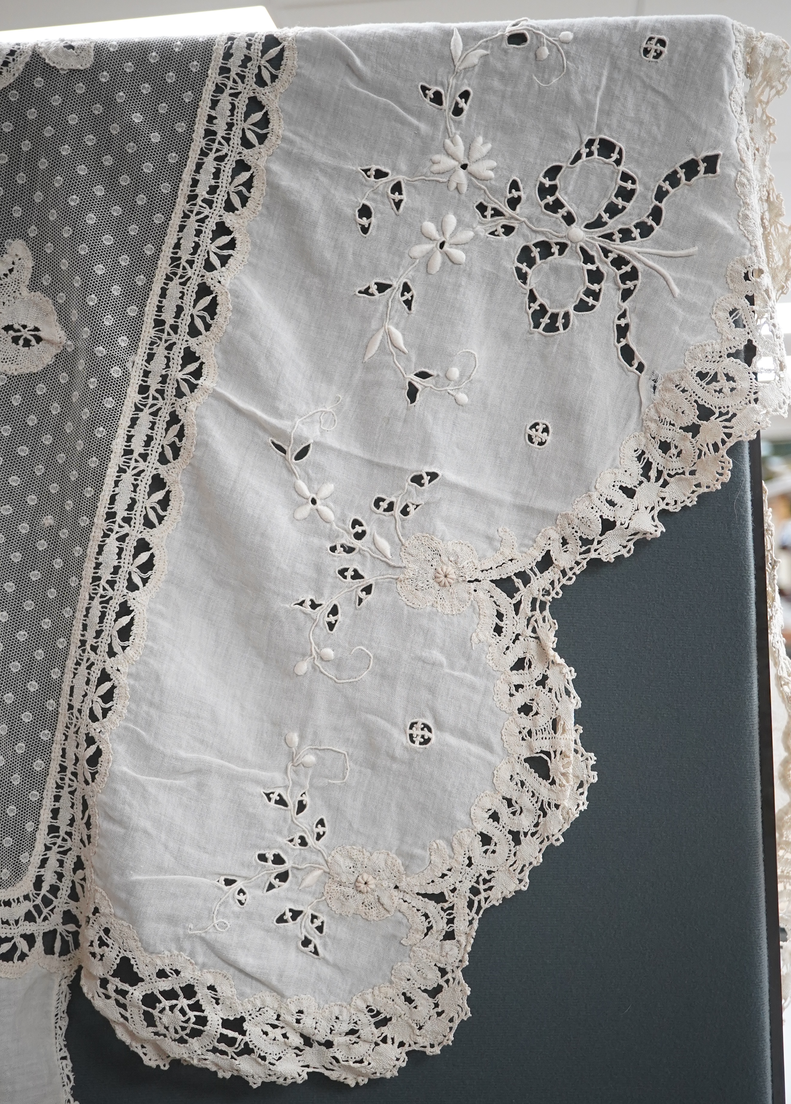 An ornate Edwardian bed cover, handmade from cut work anglaise panels, fine spot motif net and bobbin lace insertions, 228cm wide x 228 cm long. Condition - the spot motif net and fine lawn are damaged in places, the law